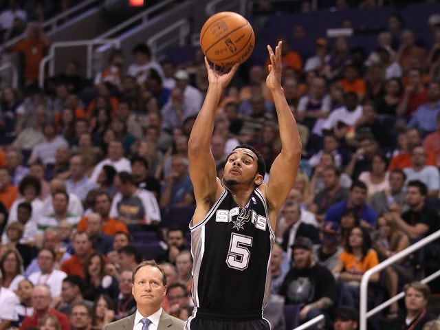 Cory Joseph #5 of the San Antonio Spurs shoots the ball against the Phoenix Suns during the NBA game at US Airways Center on April 25, 2012