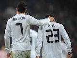 Cristiano Ronaldo and Mesut Ozil celebrate a goal scored by the former.