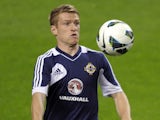 Northern Ireland's Dean Shiels warms up in Portugal on October 15, 2012