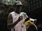 Former US basketball player Dennis Rodman signs autographs for fans during an exhibition event of the NBA Legends team against Bogota's bastketball team Los Piratas, in Bogota, Colombia, on August 8, 2013