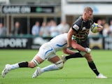 Dylan Hartley of Northampton Saints is tackled by Thom Johnson of Exeter Chiefs during the Aviva Premiership match between Northampton Saints and Exeter Chiefs at Franklin's Gardens on September 7, 2013