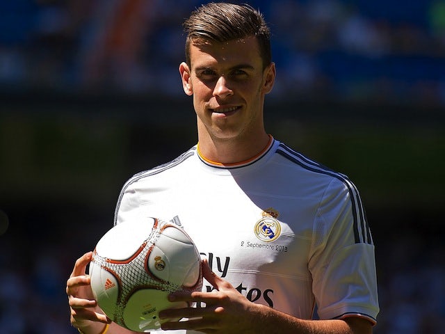 Gareth Bale poses as a Real Madrid player at the Bernabeu on September 2, 2013