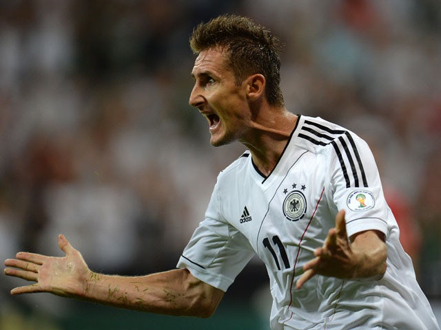 Germany's striker Miroslav Klose celebrates after scoring the 1-0 during the FIFA World Cup 2014 group C qualifying football match of Germany vs Austria on September 6, 2013