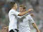 Germany's striker Miroslav Klose and midfielder Toni Kroos celebrate after the second goal for Germany during the FIFA World Cup 2014 group C qualifying football match of Germany vs Austria on September 6, 2013