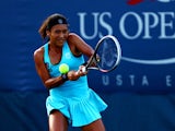 Heather Watson of Great Britain returns a shot to Simona Halep of Romania during their women's singles first round match on Day Two of the 2013 US Open at USTA Billie Jean King National Tennis Center on August 27, 2013
