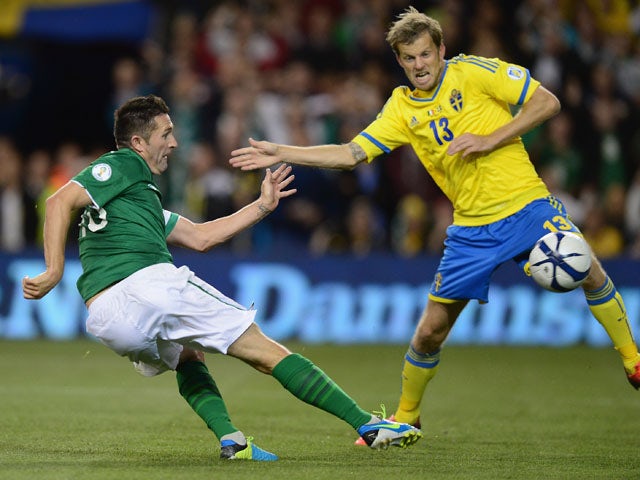 Robbie Keane of Republic of Ireland scores his goal during the FIFA 2014 World Cup Qualifying Group C match between Republic of Ireland and Sweden at Aviva Stadium on September 6, 2013