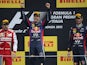 Red Bull Racing's German driver Sebastian Vettel and Red Bull Racing's Australian driver celebrates on the podium at the Autodromo Nazionale circuit in Monza on September 8, 2013