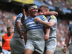 Jamie George of Saracens is mobbed by team mates after scoring his second try during the Aviva Premiership match between London Irish and Saracens at Twickenham Stadium on September 7, 2013