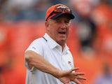 Head coach John Fox of the Denver Broncos watches his team warm up prior to the game against the Baltimore Ravens during the game at Sports Authority Field at Mile High on September 5, 2013
