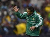 Mexico's coach Jose Manuel de la Torre gestures during their Brazil 2014 FIFA World Cup CONCACAF qualifier match against Honduras, at the Azteca Stadium in Mexico City, on September 6, 2013