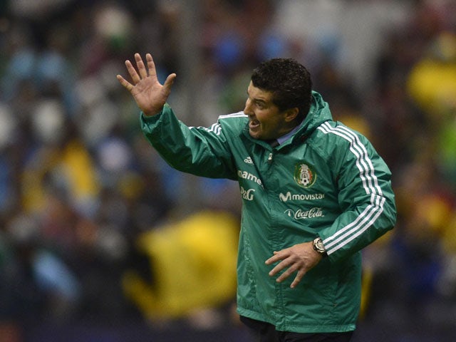 Mexico's coach Jose Manuel de la Torre gestures during their Brazil 2014 FIFA World Cup CONCACAF qualifier match against Honduras, at the Azteca Stadium in Mexico City, on September 6, 2013
