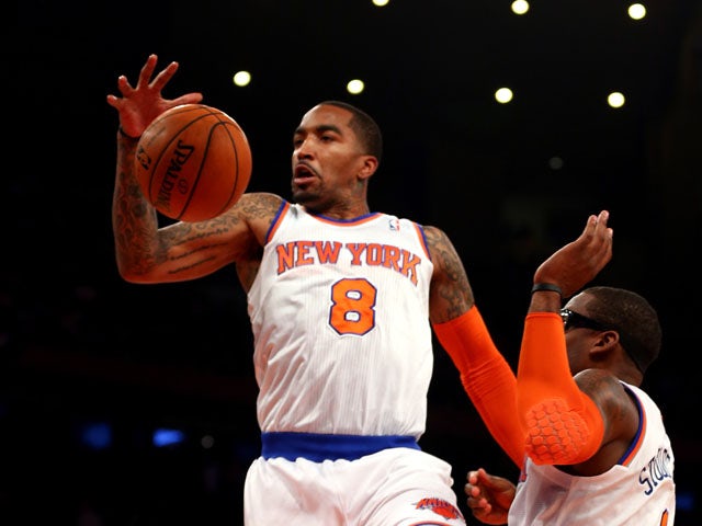J.R. Smith #8 of the New York Knicks rebounds the ball against the Indiana Pacers during Game Five of the Eastern Conference Semifinals of the 2013 NBA Playoffs at Madison Square Garden on May 16, 2013