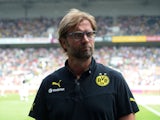 Dortmund's head coach Jurgen Klopp gives interviews prior to the Telekom Cup football match Borussia Moenchengladbach vs Borussia Dortmund in the German city of Moenchengladbach on July 20, 2013