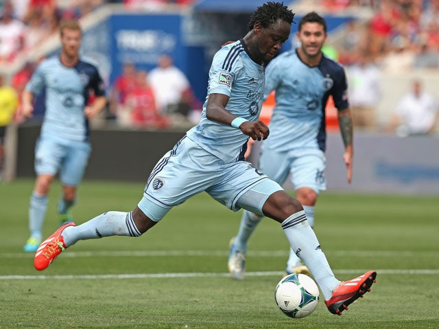 Kei Kamara #23 of Sporting Kansas City moves up the field against the Chicago Fire during an MLS match at Toyota Park on July 7, 2013