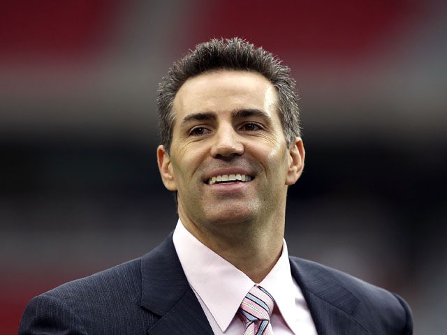 Former Arizona Cardinals quarterback Kurt Warner walks on the field prior to the NFL game against the New Orleans Saints at the University of Phoenix Stadium on October 10, 2010
