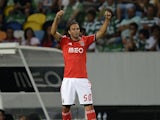 Benfica's Serb forward Lazar Markovic celebrates after his team scored the equalizer during the Portuguese league football match Sporting CP vs SL Benfica at the Jose Alvalade stadium in Lisbon on August 31, 2013