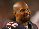 Matt Forte #22 of the Chicago Bears smiles at a teammate on the sidelines during a game against the San Diego Chargers at Soldier Field on August 15, 2013