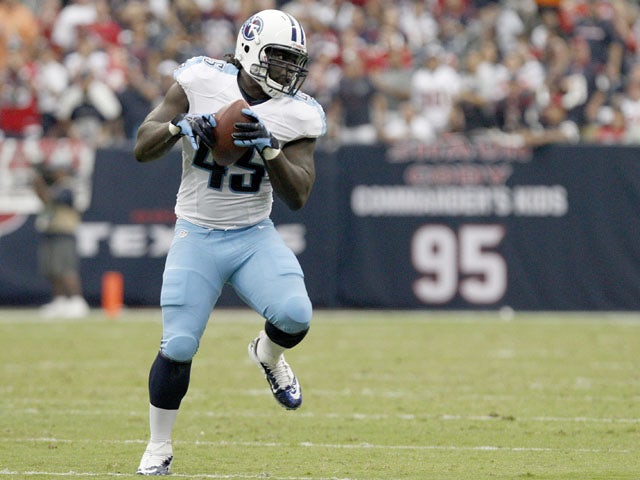 Quinn Johnson #45 of the Tennessee Titans runs after the catch against the Houston Texans on September 30, 2012
