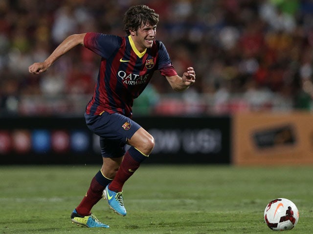 Sergi Roberto #24 of Barcelona makes a break against Thailand XI during the international friendly match between Thailand XI and FC Barcelona at Rajamangala Stadium on August 7, 2013