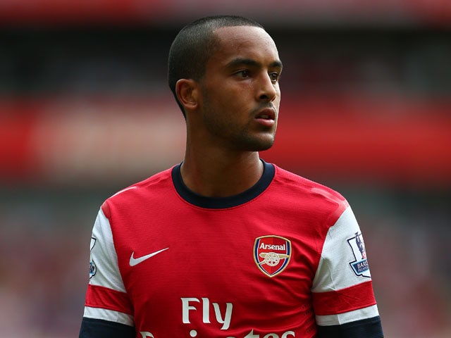 Theo Walcott of Arsenal in action during the Barclays Premier League match between Arsenal and Tottenham Hotspur at Emirates Stadium on September 01, 2013