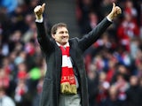 Arsenal legend Tony Adams is seen on the pitch before the Barclays Premier League match between Arsenal and Queens Park Rangers at the Emirates Stadium on December 31, 2011