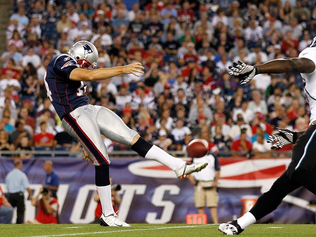 Zoltan Mesko #14 of the New England Patriots punts against the defense of Alvin Bowen #54 of the Jacksonville Jaguars during a preseason game at Gillette Stadium on August 11, 2011