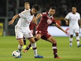 AC Milan's Kaka fends off a Torino player on September 14, 2013