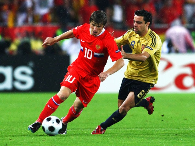 Andrei Arshavin of Russia is challenged by Xavi Hernandez of Spain during the UEFA EURO 2008 Semi Final match between Russia and Spain at Ernst Happel Stadion on June 26, 2008