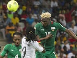 Augsburg striker Aristide Bance heads for goal while on international duty with Burkina Faso.