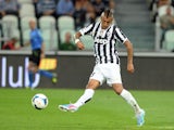 Arturo Vidal of FC Juventus scores the first goal during the Serie A match between Juventus and SS Lazio at Juventus Arena on August 31, 2013