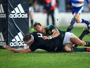 New Zealand's Brodie Retallick scores a try against South Africa during their Rugby Championship match on September 14, 2013