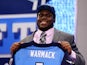 Chance Warmack of the Alabama Crimson Tide holds up a jersey on stage after he was picked #10 overall by the Tennessee Titans in the first round of the 2013 NFL Draft at Radio City Music Hall on April 25, 2013