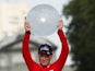 Chris Horner poses on the podium with the trophy after winning the 'Vuelta' Tour of Spain in Madrid on September 15, 2013. 