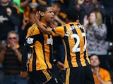 Hull's Curtis Davies is congratulated by team mate Ahmed Elmohamady after scoring the opening goal against Cardiff on September 14, 2013