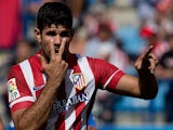 Atletico Madrid's Diego Costa celebrates after scoring his team's second goal against Almeria on September 14, 2013