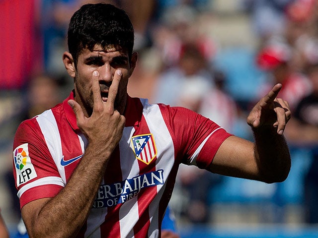 Atletico Madrid's Diego Costa celebrates after scoring his team's second goal against Almeria on September 14, 2013