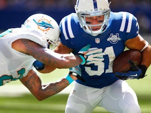 Miami defense holds firm to beat Colts