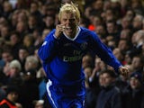 Eidur Gudjohnsen of Chelsea celebrates scoring the first goal during the UEFA Champions League Quarter Final match between Chelsea and Arsenal at Stamford Bridge on March 24, 2004