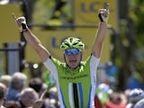 Elia Viviani celebrates as he crosses the finish line at the end of the 191 km second stage of the 65th edition of the Dauphine Criterium cycling race on June 3, 2013