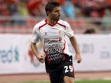 Fabio Borini of Liverpool runs with the ball during the international friendly match between Thailand and Liverpool at the Rajamangala Stadium on July 28, 2013