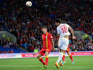 Serbia's Filip Dordevic heads in the opening goal against Wales during their World Cup qualifying match on September 10, 2013