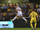 Real Madrid midfielder Gareth Bale heads the ball during his debut against Villarreal on September 14, 2013