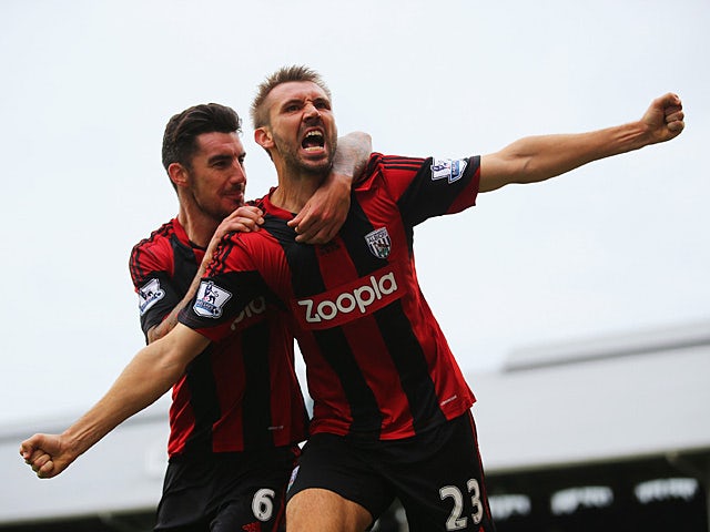 West Brom's Gareth McAuley celebrates with team mate Liam Ridgewell after scoring a late equaliser against Fulham on September 14, 2013