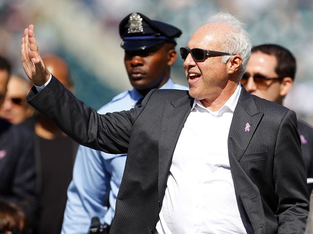 Jeffrey Lurie, owner of the Philadelphia Eagles, waves from the field before the start of a game against the Detroit Lions at Lincoln Financial Field on October 14, 2012