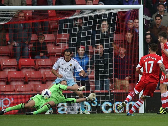 West Ham's Jussi Jaaskelainen saves Southampton's Dani Osvaldo shot on goal during their Premier League match on September 15, 2013