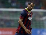Barcelona's Martin Montoya in action against Malaysia XI during a friendly match on August 10, 2013