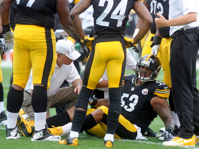 Maurkice Pouncey #53 of the Pittsburgh Steelers lays on the grass after suffering an injury against the Tennessee Titans during the first quarter at Heinz Field on September 8, 2013