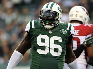 Muhammad Wilkerson #96 of the New York Jets celebrates his sack of quarterback Ryan Lindley of the Arizona Cardinals on December 2, 2012