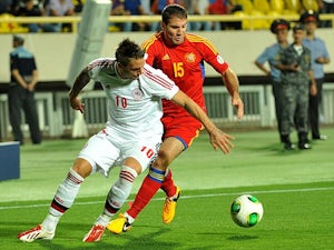 Denmark's Nicki Nielson and Armenia's Hrayr Mkoyan battle for the ball during their World Cup qualifying match on September 10, 2013