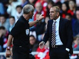 Referee Martin Atkinson has words with Sunderland manager Paolo Di Canio on the touchline during the match against Arsenal on September 14, 2013